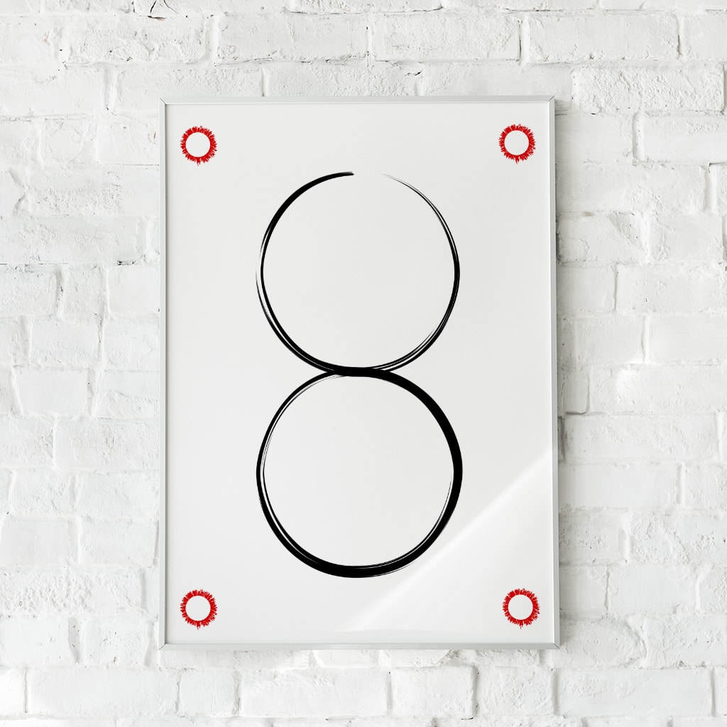 Minimalistisk plakat med to sorte cirkler og røde detaljer. Skaber balance og fokus.